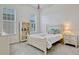 Cozy bedroom with carpet, a dresser, a nightstand, and two large windows at 14003 Hampshire Bay Cir, Winter Garden, FL 34787