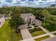 Stunning exterior view of a two-story home boasting manicured landscaping and a spacious three-car garage at 14003 Hampshire Bay Cir, Winter Garden, FL 34787