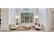 Bright living room with soaring ceilings and a large window that floods the space with natural light at 14003 Hampshire Bay Cir, Winter Garden, FL 34787
