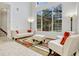 Bright living room with soaring ceilings and a large window that floods the space with natural light at 14003 Hampshire Bay Cir, Winter Garden, FL 34787