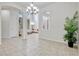 Bright living room with soaring ceilings is connected to other rooms through elegant archways at 14003 Hampshire Bay Cir, Winter Garden, FL 34787