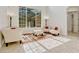 Bright living room with soaring ceilings and a large window that floods the space with natural light at 14003 Hampshire Bay Cir, Winter Garden, FL 34787