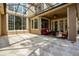 Large outdoor patio with tile, seating, glass windows, and overhead lights, creating an inviting space at 14003 Hampshire Bay Cir, Winter Garden, FL 34787