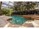 Large screened pool and spa area features well-maintained landscaping for added privacy and tranquility at 14003 Hampshire Bay Cir, Winter Garden, FL 34787