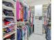 Spacious walk-in closet with ample shelving, cabinets, and plenty of room for storage at 14003 Hampshire Bay Cir, Winter Garden, FL 34787
