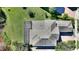 Aerial view of a home with a large yard, screened in patio, and a brick driveway at 14906 Speer Lake Dr, Winter Garden, FL 34787