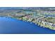 Beautiful aerial of waterfront homes on lake with boat docks, landscaping, and community amenities at 14906 Speer Lake Dr, Winter Garden, FL 34787