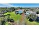 Sprawling backyard with lush lawn, mature trees, screened patio and plenty of space for recreation at 14906 Speer Lake Dr, Winter Garden, FL 34787