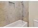 Bathroom featuring a shower and bathtub with tile surround at 14906 Speer Lake Dr, Winter Garden, FL 34787