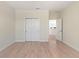 Bedroom with hardwood floors, closet, and ample natural light at 14906 Speer Lake Dr, Winter Garden, FL 34787