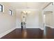Dining room with dark hardwood floors and a modern chandelier at 14906 Speer Lake Dr, Winter Garden, FL 34787