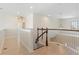 Second floor hallway with wood floors and bright white trim at 14906 Speer Lake Dr, Winter Garden, FL 34787