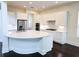 Spacious kitchen with white cabinets, stainless steel appliances, and large island at 14906 Speer Lake Dr, Winter Garden, FL 34787