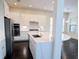 Open kitchen with stainless steel appliances, quartz countertops, and a breakfast nook at 14906 Speer Lake Dr, Winter Garden, FL 34787