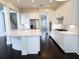 Bright kitchen featuring white cabinets, a large island, and stainless steel appliances at 14906 Speer Lake Dr, Winter Garden, FL 34787