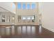 Spacious living room with hardwood floors, large windows, and plenty of natural light at 14906 Speer Lake Dr, Winter Garden, FL 34787