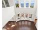 Open living room with lake views, floor-to-ceiling windows and hardwood floors at 14906 Speer Lake Dr, Winter Garden, FL 34787