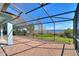 Spacious screened-in patio with lake views, perfect for enjoying the outdoors at 14906 Speer Lake Dr, Winter Garden, FL 34787