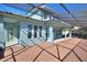 Screened patio area with brick flooring, offering serene views and outdoor living space at 14906 Speer Lake Dr, Winter Garden, FL 34787