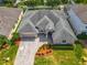 Aerial view of house showing roof, driveway, landscaping, and surrounding neighborhood at 17146 Cypress Preserve Pkwy, Orlando, FL 32820