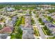 An aerial view of a neighborhood featuring well-maintained homes and community amenities at 17146 Cypress Preserve Pkwy, Orlando, FL 32820
