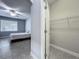 The bedroom leads to a closet and features tiled floors, a ceiling fan, and a window at 17146 Cypress Preserve Pkwy, Orlando, FL 32820