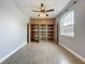 Empty bonus room with ceiling fan, tile floors, a window and built-ins at 17146 Cypress Preserve Pkwy, Orlando, FL 32820