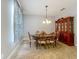 Dining room with elegant furniture, chandelier lighting, and neutral wall color at 17146 Cypress Preserve Pkwy, Orlando, FL 32820