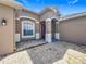 Inviting entryway with brick pavers, covered porch, and view of the home's front door and exterior features at 17146 Cypress Preserve Pkwy, Orlando, FL 32820