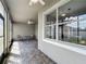 Screened lanai with brick flooring and views of the backyard at 17146 Cypress Preserve Pkwy, Orlando, FL 32820