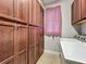 Laundry room with storage cabinets, washer and dryer, and a window at 17146 Cypress Preserve Pkwy, Orlando, FL 32820