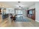Open-concept living room with tile flooring, ceiling fan, and ample space for entertaining guests at 17146 Cypress Preserve Pkwy, Orlando, FL 32820