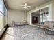 Covered and screened porch featuring tiled floors and ceiling fan at 17146 Cypress Preserve Pkwy, Orlando, FL 32820