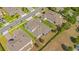 Aerial shot features the backyard of a home with a fence and its neighborhood location at 1780 Southern Red Oak Ct, Ocoee, FL 34761