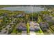 Aerial view of a home with a lake view, a community pool and a playground in the neighborhood at 1780 Southern Red Oak Ct, Ocoee, FL 34761