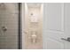 Bathroom showcasing a modern toilet and vanity with a tiled shower at 1780 Southern Red Oak Ct, Ocoee, FL 34761