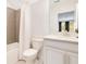Bathroom featuring tiled shower, modern fixtures, and vanity with sink at 1780 Southern Red Oak Ct, Ocoee, FL 34761