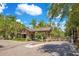 Gated community entrance with stone features and lush landscaping offers secure and private neighborhood access at 1780 Southern Red Oak Ct, Ocoee, FL 34761