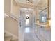 Bright foyer with tile flooring, contemporary lighting, and a decorative entry table at 1780 Southern Red Oak Ct, Ocoee, FL 34761