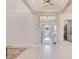 Bright foyer with tile flooring, contemporary lighting, and an open view of the home's interior at 1780 Southern Red Oak Ct, Ocoee, FL 34761