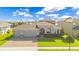 Beautiful single Gathering home with a manicured lawn, three-car garage, and brick paved driveway at 1780 Southern Red Oak Ct, Ocoee, FL 34761