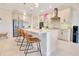 Bright kitchen featuring stainless steel appliances, large island with seating, and modern fixtures at 1780 Southern Red Oak Ct, Ocoee, FL 34761