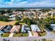 A serene neighborhood featuring well-maintained homes, lush trees, and beautifully landscaped yards at 17816 Se 115Th Ct, Summerfield, FL 34491