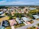 Beautiful aerial view of a Florida neighborhood with mature landscaping and colorful rooftops on a sunny day at 17816 Se 115Th Ct, Summerfield, FL 34491