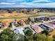Beautiful aerial view of Florida homes overlooking a golf course with a pond on a sunny day at 17816 Se 115Th Ct, Summerfield, FL 34491