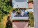 Overhead view of a well-maintained home showcasing the roof, landscaping, and surrounding neighborhood at 17816 Se 115Th Ct, Summerfield, FL 34491