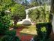 Enclosed backyard features lush landscaping and mulch beds for a private, serene setting at 17816 Se 115Th Ct, Summerfield, FL 34491