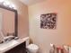 Bathroom featuring a dark wood vanity and neutral color walls at 17816 Se 115Th Ct, Summerfield, FL 34491