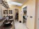 Bathroom with a double vanity, tile floors, walk-in closet, and a view to the bedroom at 17816 Se 115Th Ct, Summerfield, FL 34491