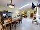Open concept dining room and living room filled with natural light and stylish decor at 17816 Se 115Th Ct, Summerfield, FL 34491